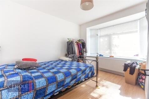 A bright and inviting double bedroom featuring ...