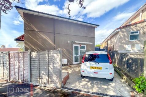 A bright and well-maintained front view of a de...