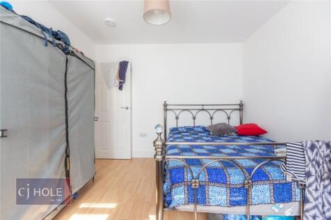 Bright and tidy double bedroom featuring a meta...