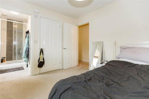 Bright and spacious master bedroom featuring a ...