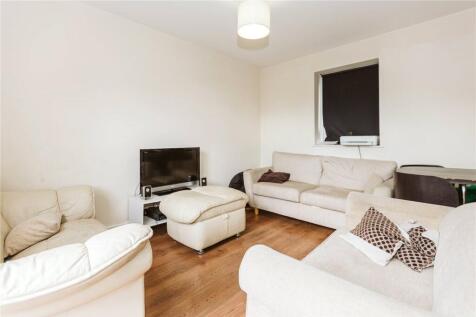 A cozy living room featuring comfortable sofas ...
