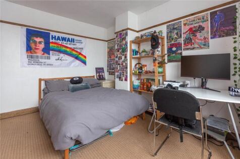 A cozy and well-decorated double bedroom featur...