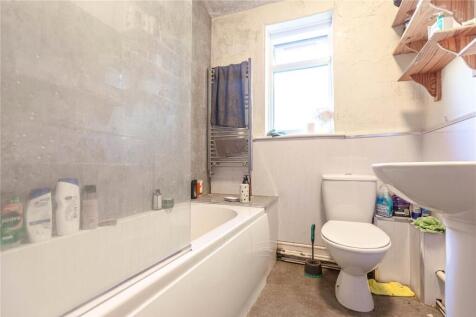 Bright and clean bathroom featuring a modern ba...