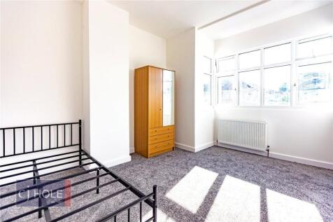 Bright and airy double bedroom featuring a larg...