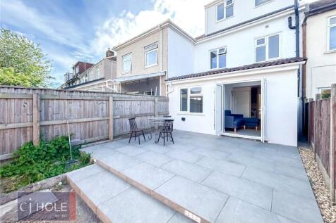 Bright and spacious garden with a large paved p...