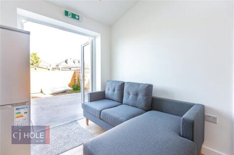 Bright and modern living room with a comfortabl...