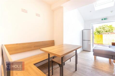 A bright and inviting living room featuring a c...
