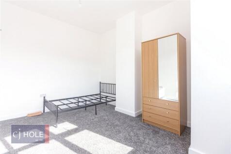 Bright and airy double bedroom featuring a larg...