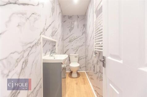 A modern and clean single toilet room featuring...