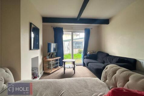 A cozy and inviting living room featuring comfo...