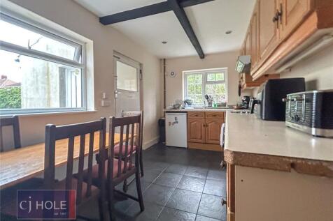 Bright and functional kitchen featuring natural...