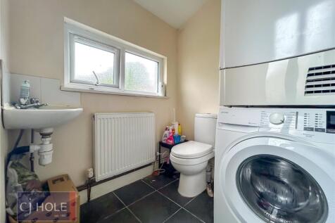 A clean and functional bathroom featuring a was...
