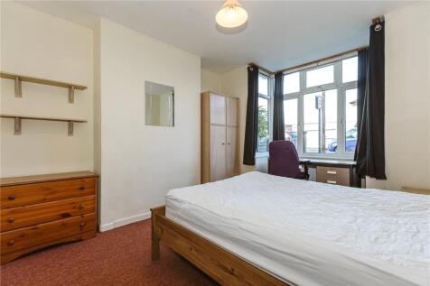 A bright and tidy double bedroom featuring a la...