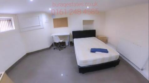 A tidy double bedroom with a comfortable bed, s...