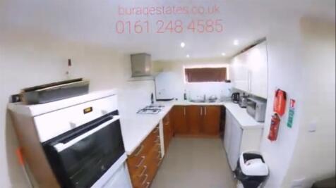 Bright and modern kitchen featuring ample count...