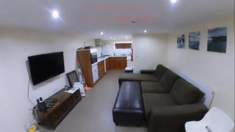 A comfortable and modern living room featuring ...