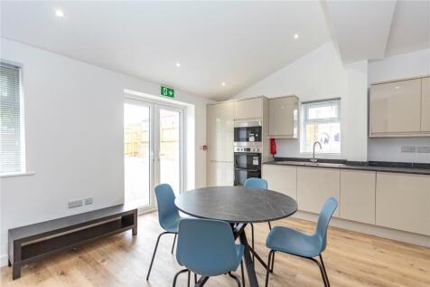 Bright and modern kitchen with ample natural li...