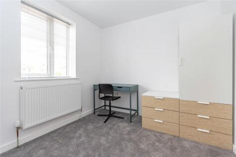 Bright and tidy single bedroom featuring a larg...