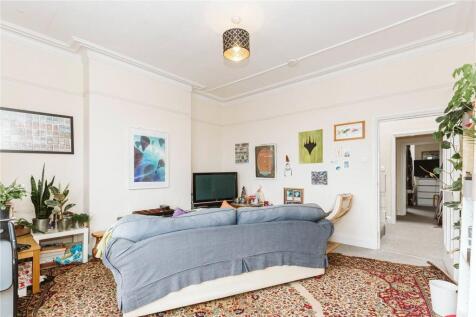 A spacious and inviting master bedroom featurin...