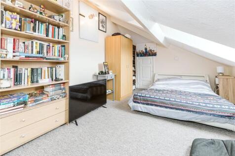 Bright and cozy double bedroom featuring a comf...