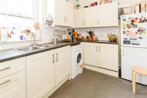 Bright and functional kitchen featuring ample w...