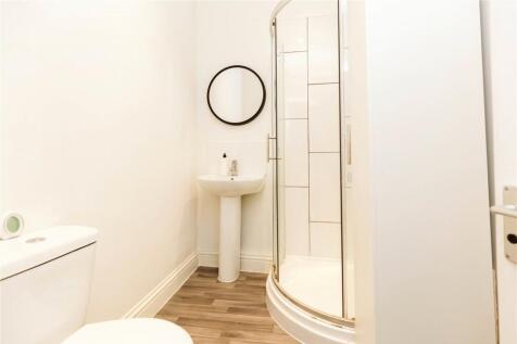 A bright and well-maintained bathroom suite fea...