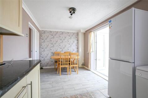 Bright and modern kitchen area featuring a spac...