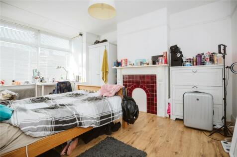 Bright and inviting double bedroom featuring la...