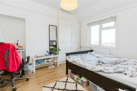 Bright and welcoming double bedroom featuring a...