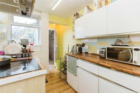 Bright and functional kitchen space featuring w...