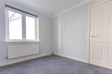 A bright and clean double bedroom featuring a l...