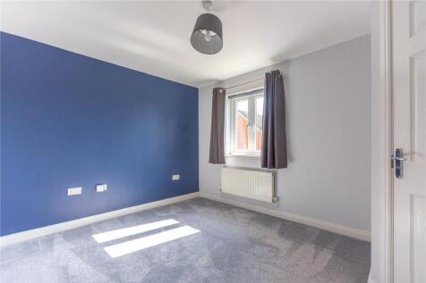 A bright double bedroom featuring a striking bl...
