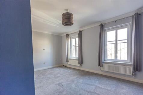 Bright and airy double bedroom featuring two la...