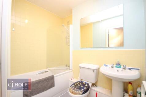 A bright and well-maintained bathroom featuring...