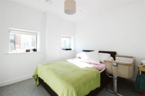 Bright and tidy double bedroom featuring a comf...