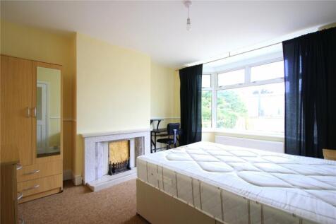 Bright and spacious master bedroom featuring a ...