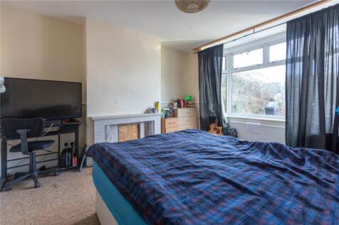 A spacious master bedroom featuring a large dou...