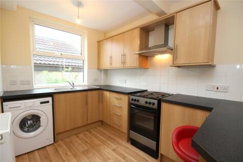 A bright and inviting kitchen featuring modern ...