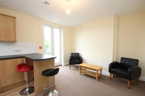 Bright living area featuring comfortable seatin...