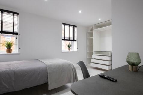 A bright and inviting double bedroom featuring ...