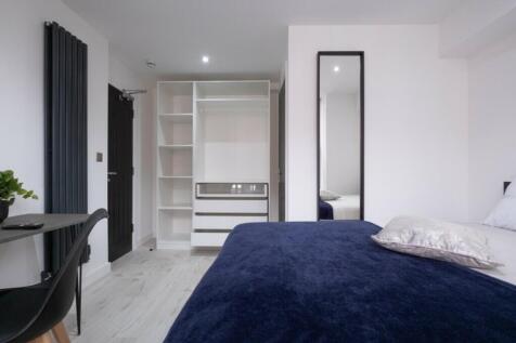 A beautifully designed double bedroom featuring...