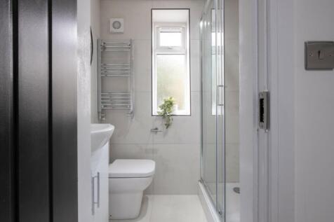 A well-maintained bathroom featuring a modern s...