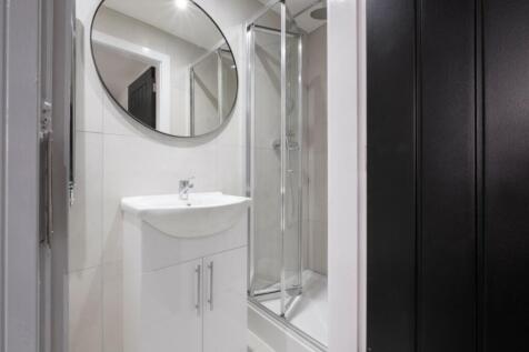 A modern bathroom featuring a sleek design with...