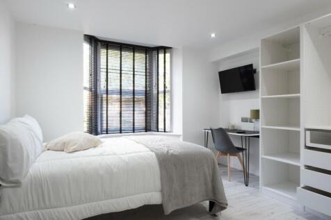 A bright and inviting double bedroom featuring ...
