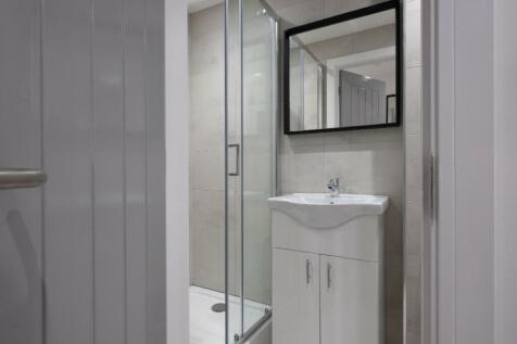 Modern bathroom featuring a sleek shower, styli...