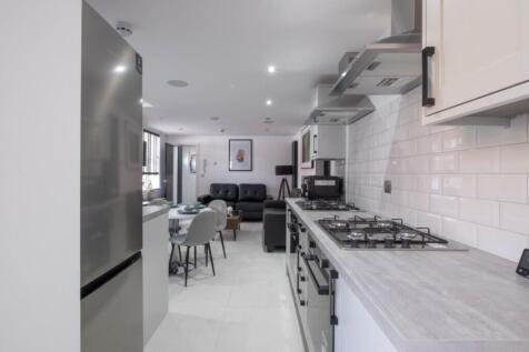 Stylish kitchen featuring modern appliances and...