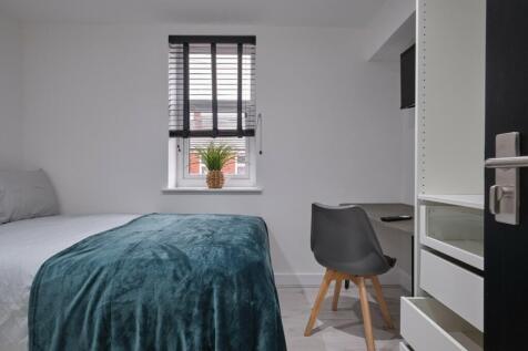 A stylish and inviting double bedroom with ampl...