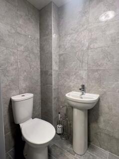 A modern, well-maintained single toilet room fe...