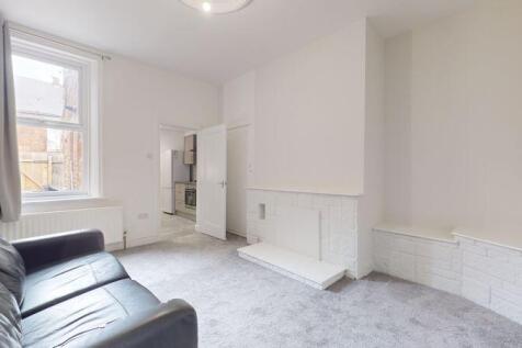 Bright and welcoming living room featuring a co...
