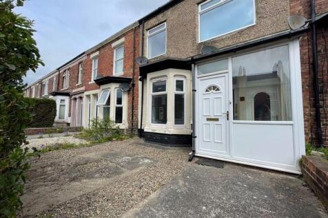 A charming terraced house front with a traditio...